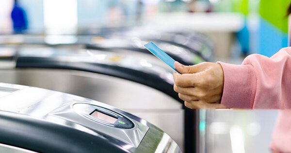Connectivity and travel essentials in Korea — tapping a transit card at a subway gate (SIM/eSIM and transport card)